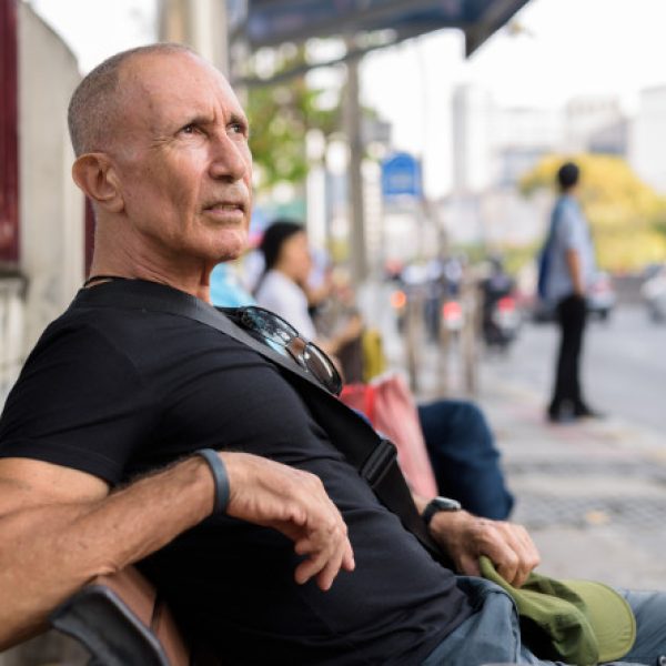 Man looking upsitting on bench