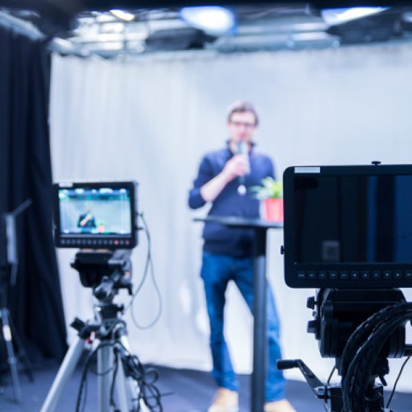 man doing interview with 2 cameras